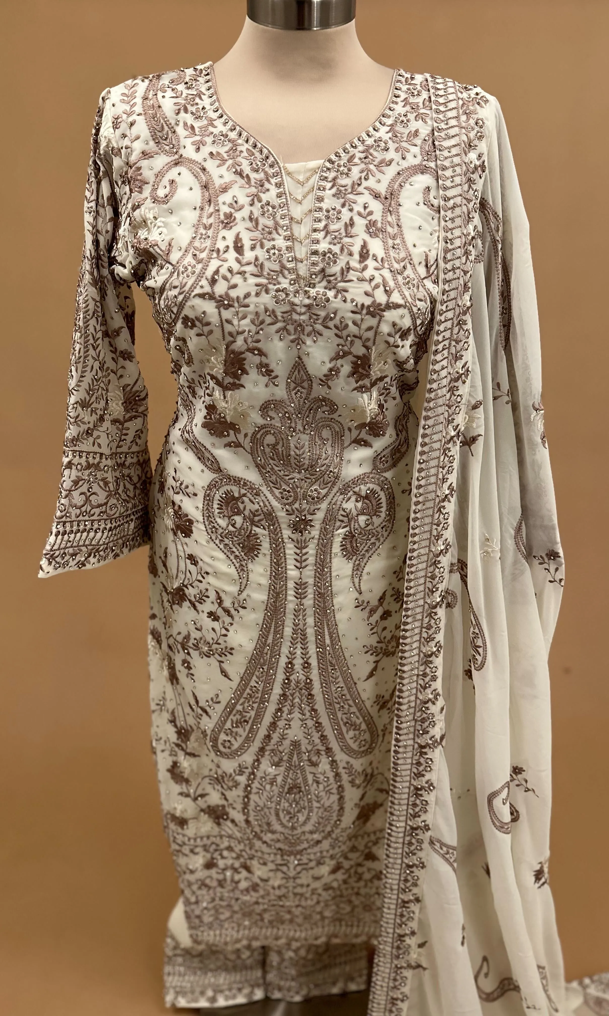 Heavy Stone Work Embroiderey Off White Color Suit With Pants On Bottom