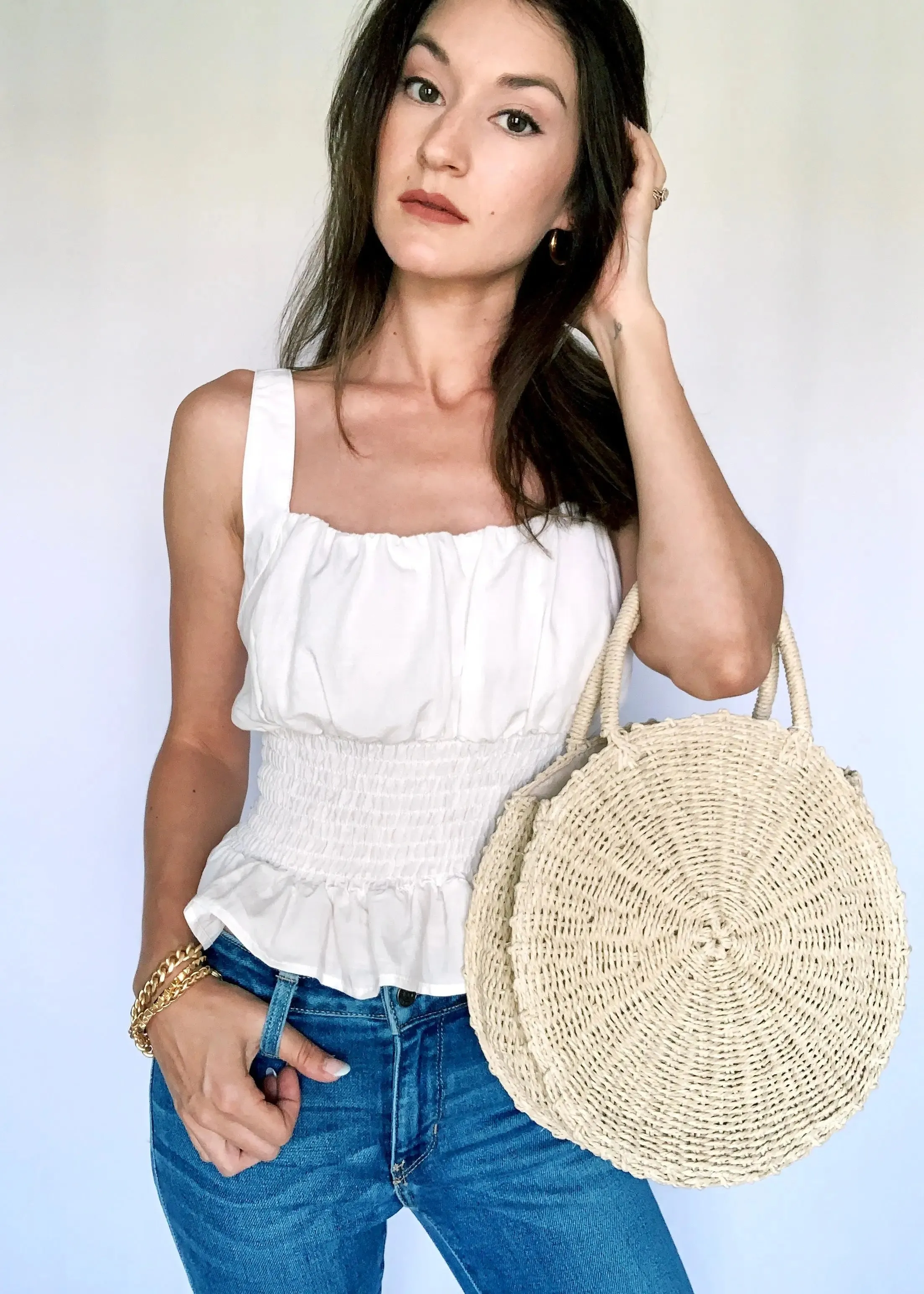 Off White Sleeveless Smocked Peplum Top